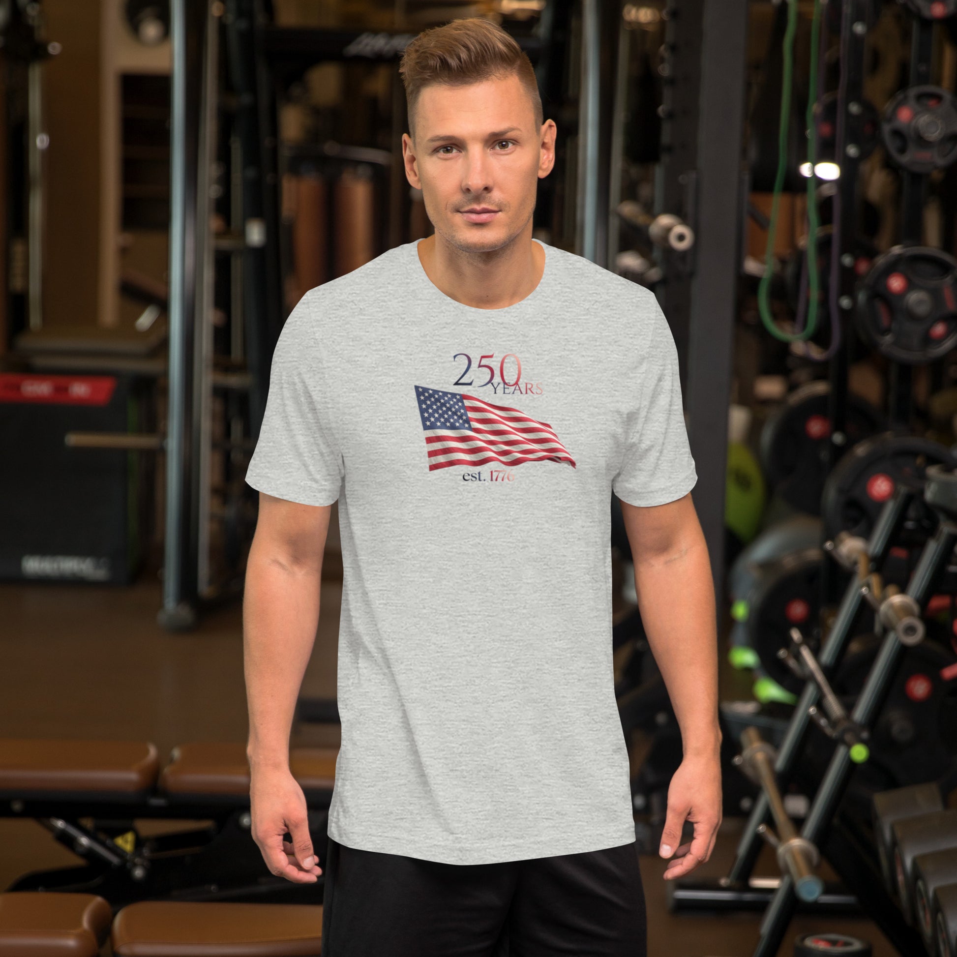 Man wearing America 250th anniversary grey t-shirt American flag graphic Est 1776 unisex fit Bella Canvas