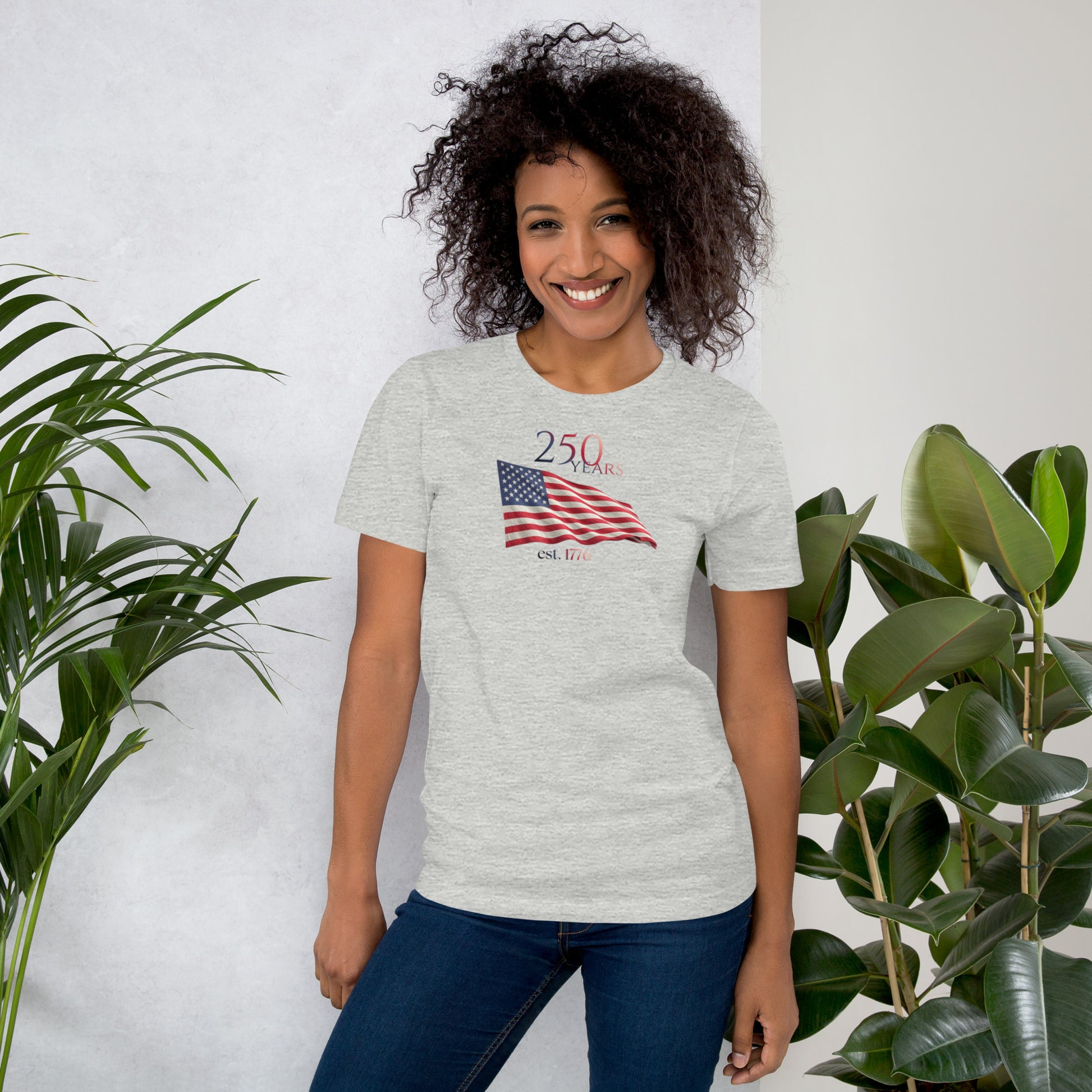 Woman wearing America 250th anniversary grey t-shirt American flag graphic Est 1776 unisex fit Bella Canvas