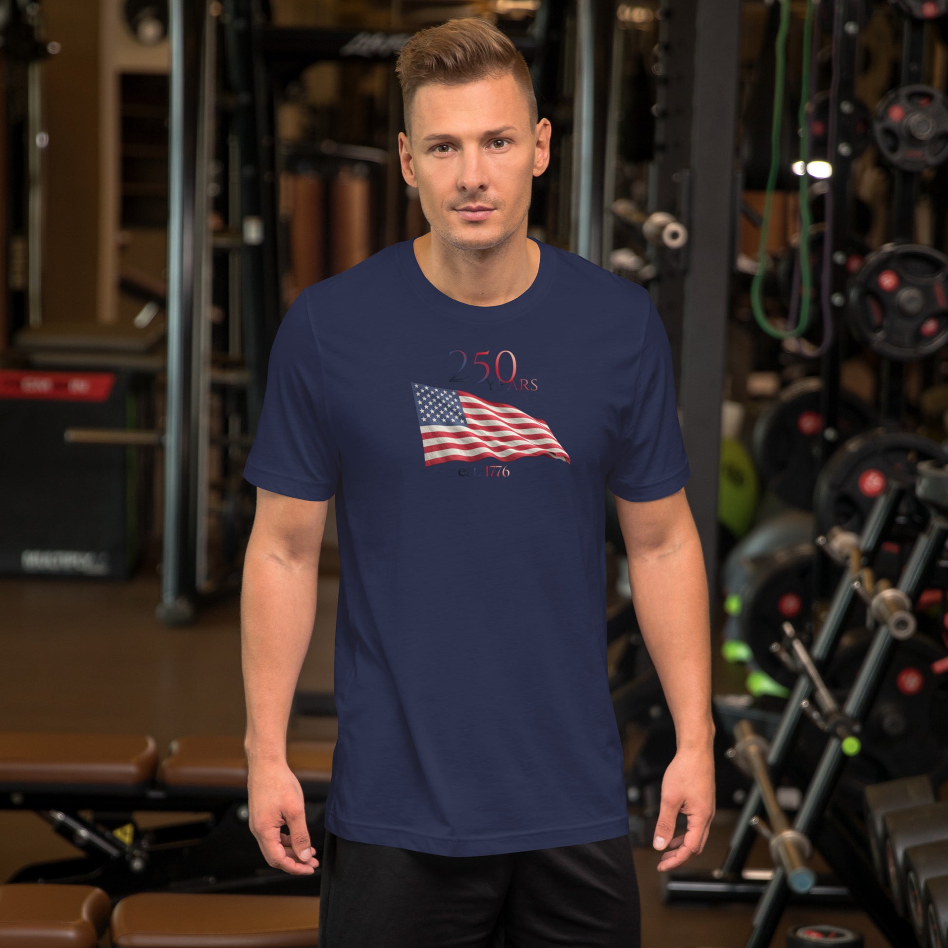 Man wearing America 250th anniversary navy t-shirt American flag graphic Est 1776 unisex fit Bella Canvas
