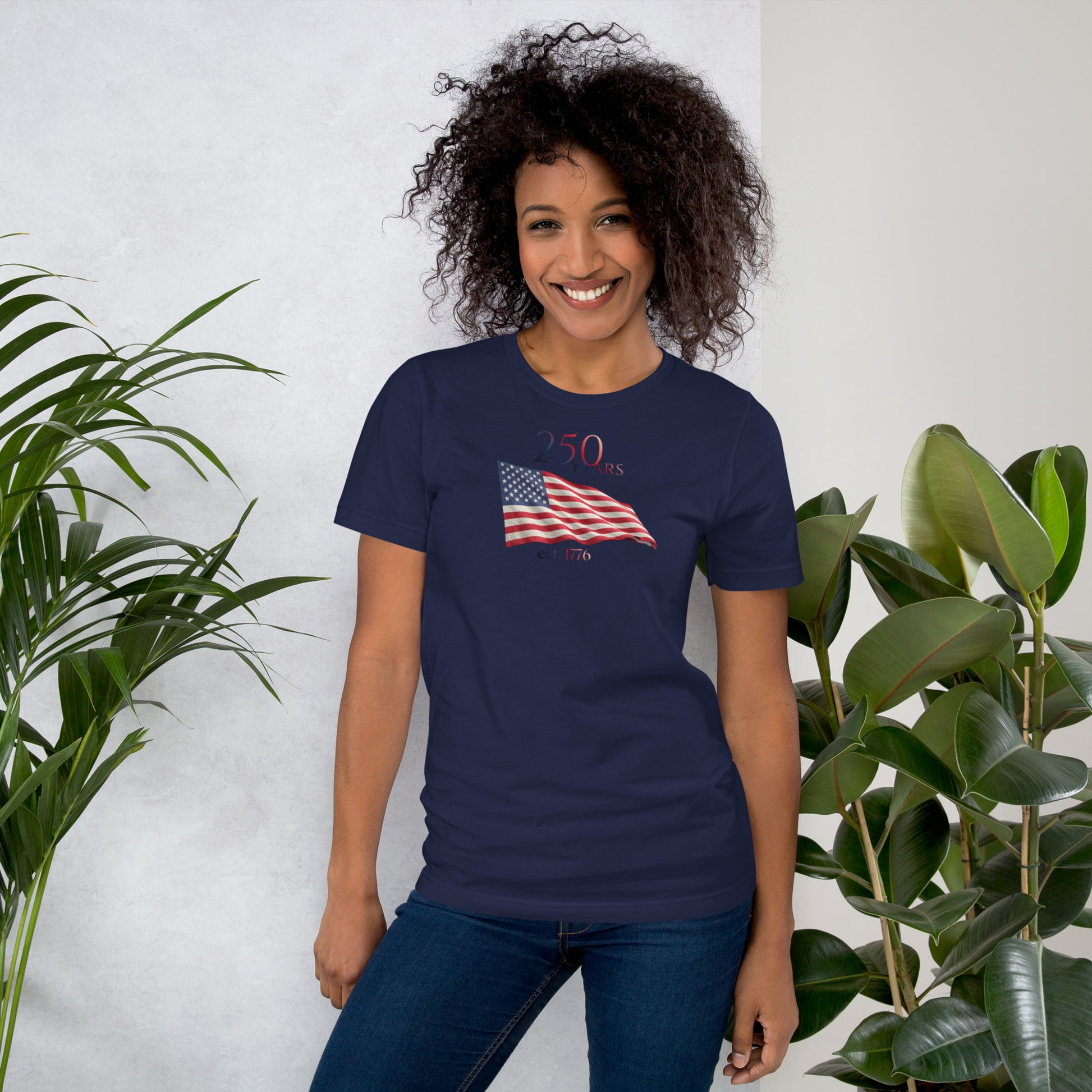 Woman wearing America 250th anniversary navy t-shirt American flag graphic Est 1776 unisex fit Bella Canvas