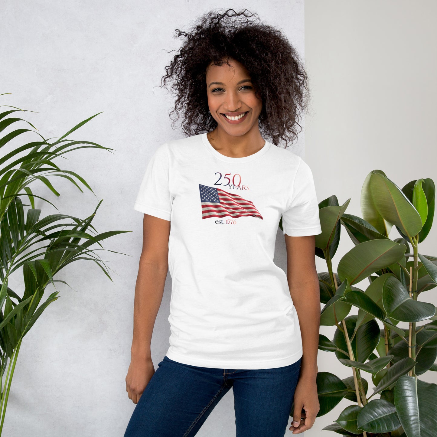 Woman wearing America 250th anniversary white t-shirt American flag graphic Est 1776 unisex fit Bella Canvas